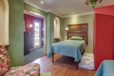 a view of balcony with wooden floor