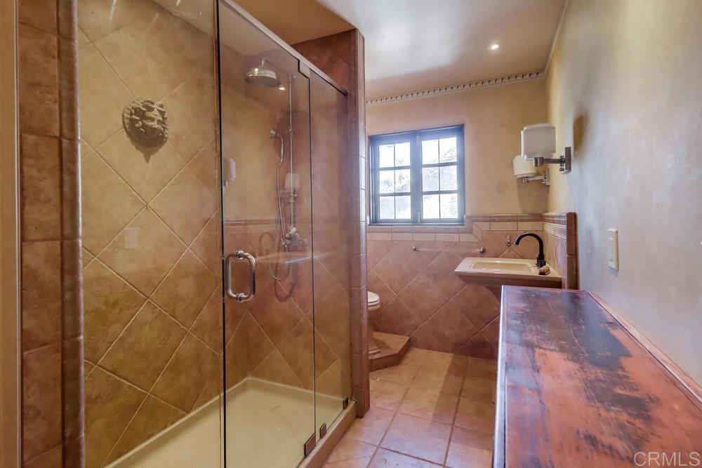 3014 Xenophon Street San Diego, CA 92106 - Photo 41 of 73 a bathroom with a sink and shower