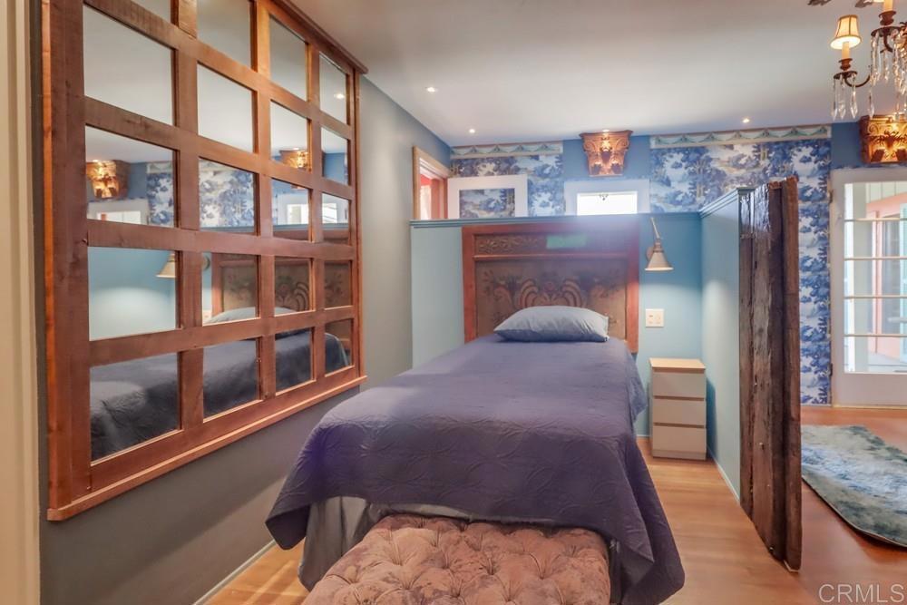 3014 Xenophon Street San Diego, CA 92106 - Photo 45 of 73 a bedroom with a bed and a large window