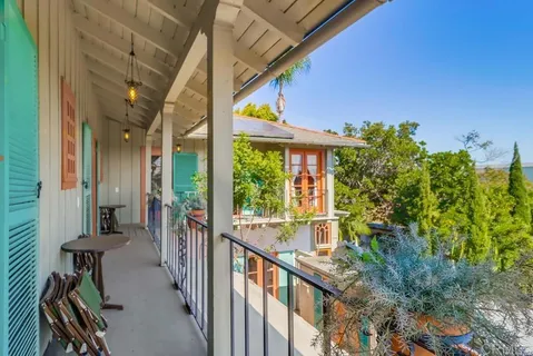 a view of a backyard with sitting area