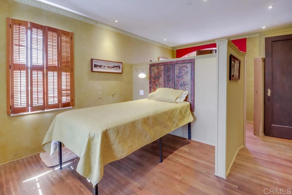3014 Xenophon Street San Diego, CA 92106 - Photo 59 of 73 a bedroom with a bed and wooden floor