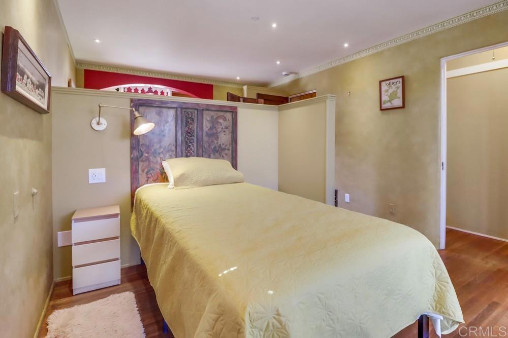 3014 Xenophon Street San Diego, CA 92106 - Photo 60 of 73 a bedroom with a bed and wooden floor