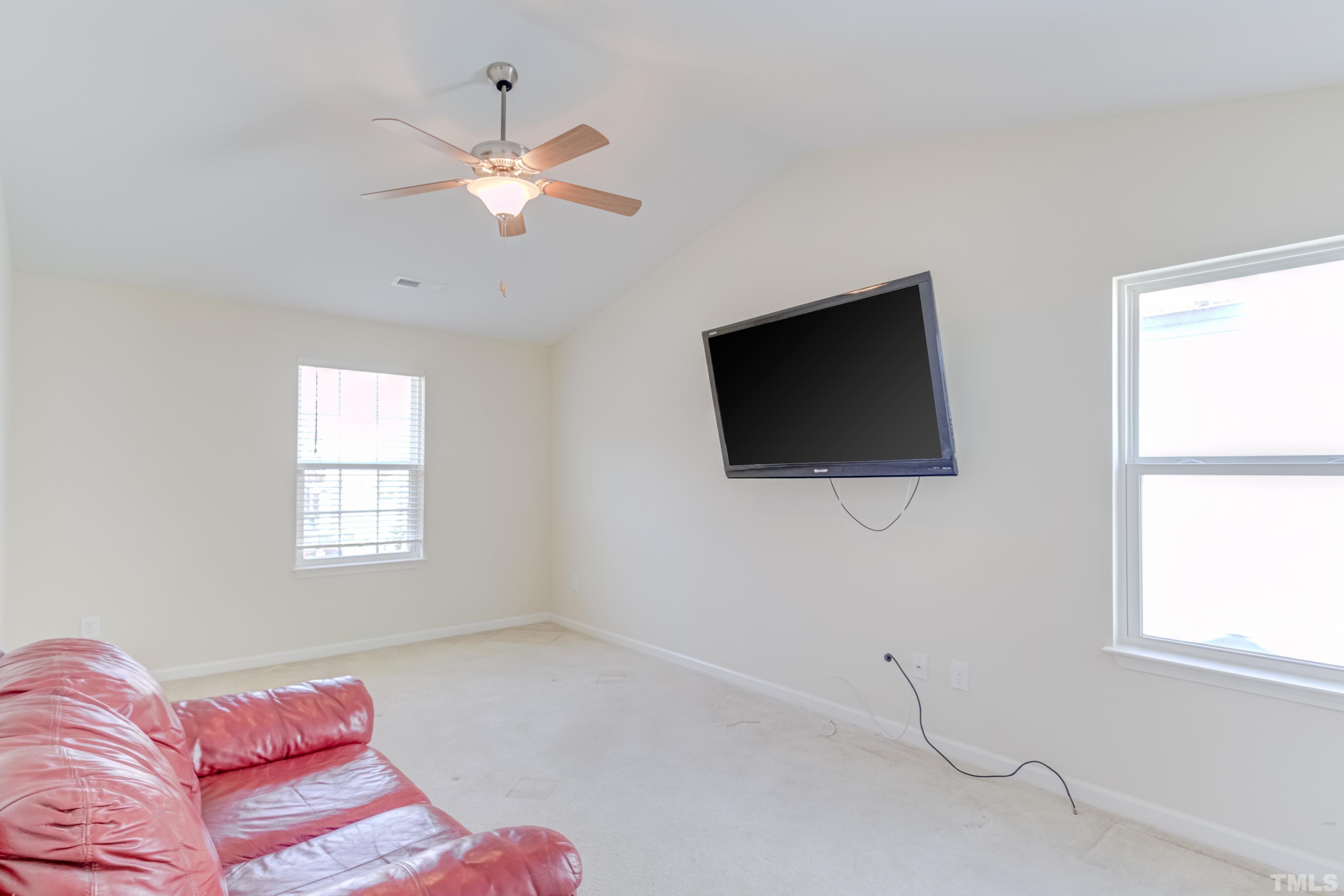 2925 Filbert Street Raleigh, NC 27610 - Photo 13 of 21 a living room with furniture and a flat screen tv