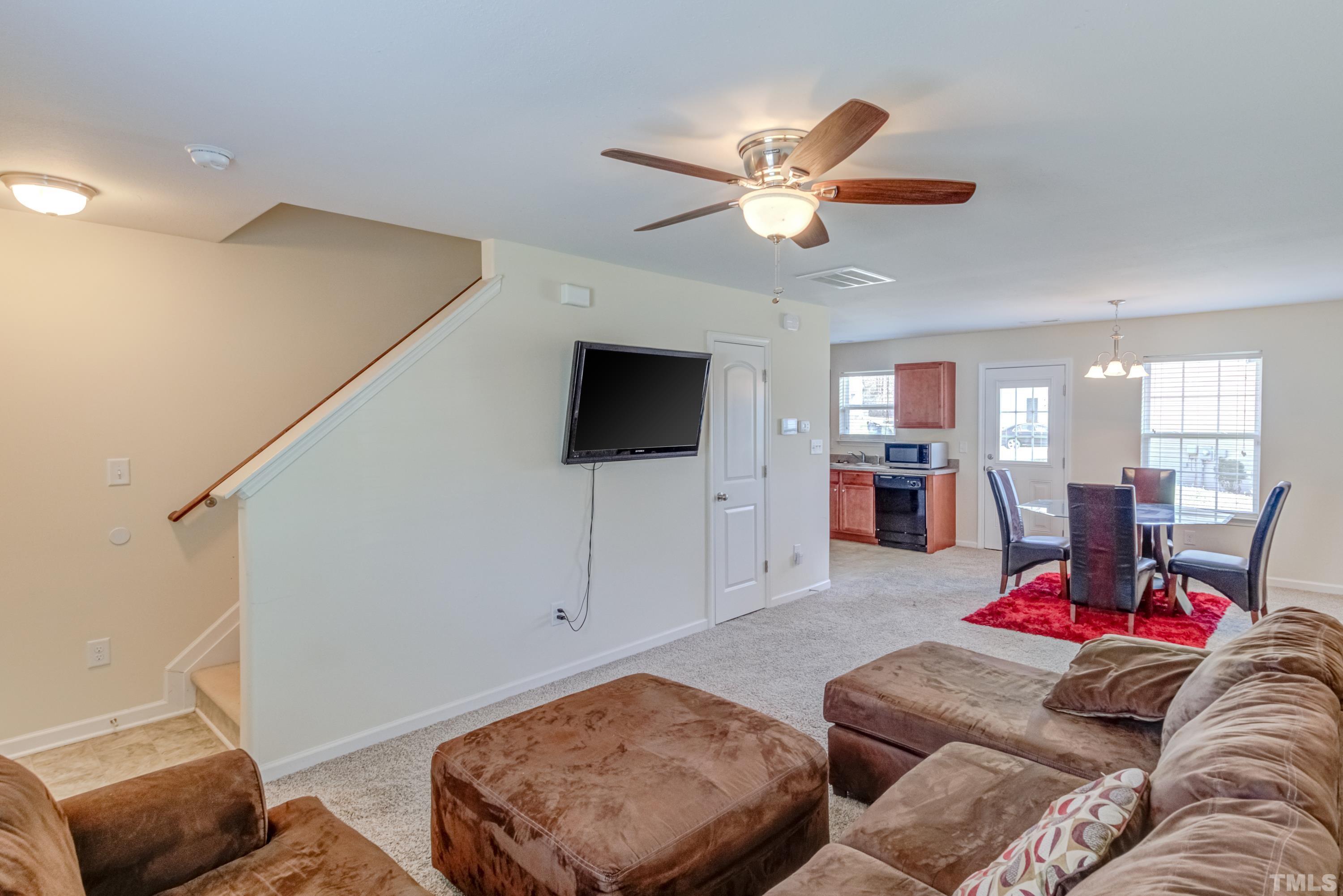 2925 Filbert Street Raleigh, NC 27610 - Photo 3 of 21 a living room with furniture and a flat screen tv