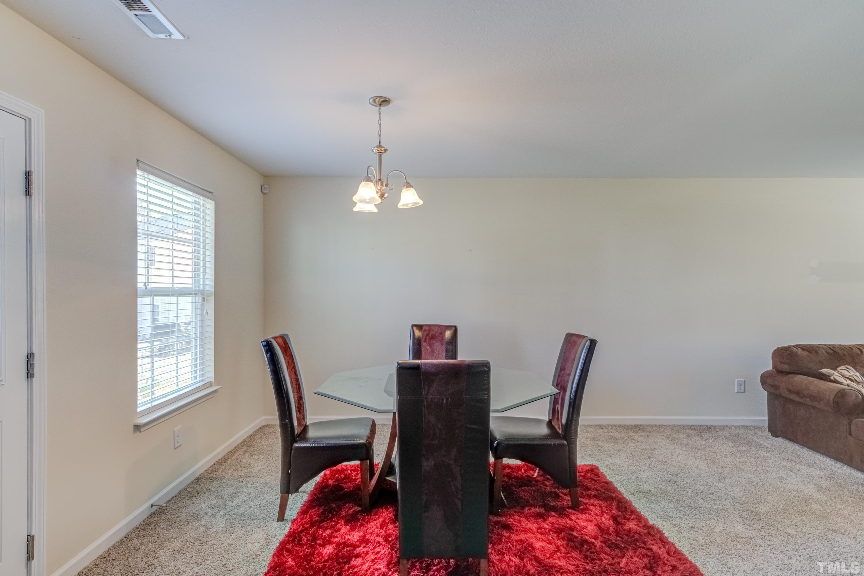 2925 Filbert Street Raleigh, NC 27610 - Photo 6 of 21 a dining room with furniture and window