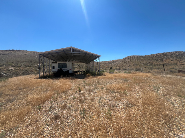 2600 South Old Wellington Road, Unit 5 Price, UT 84501 - Photo 7 of 14 Expansive open land featuring a metal-framed carport structure