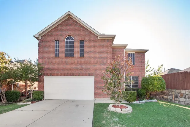 a house view with a garden space
