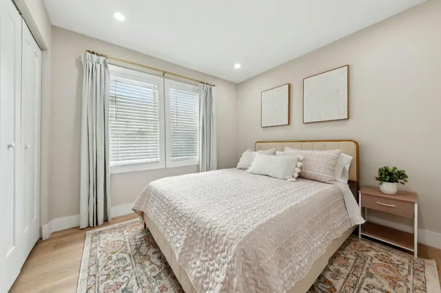 a bedroom with bed and window