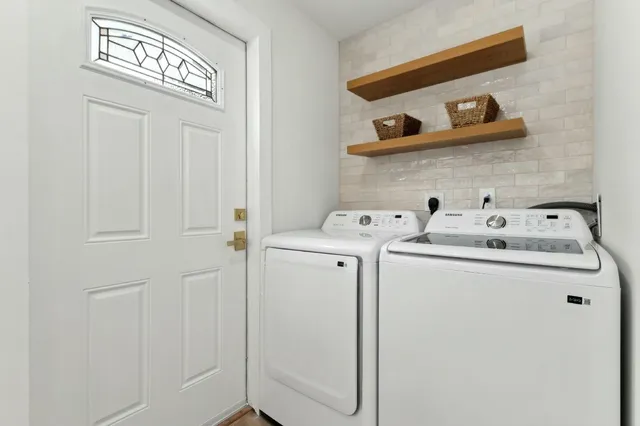 a utility room with dryer and washer