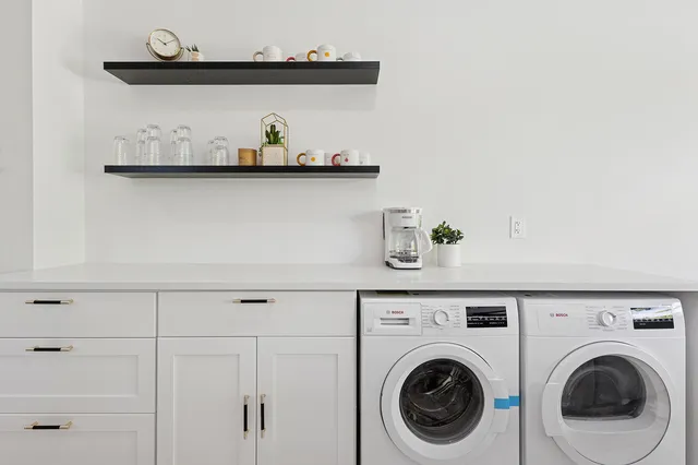 a utility room with dryer and washer