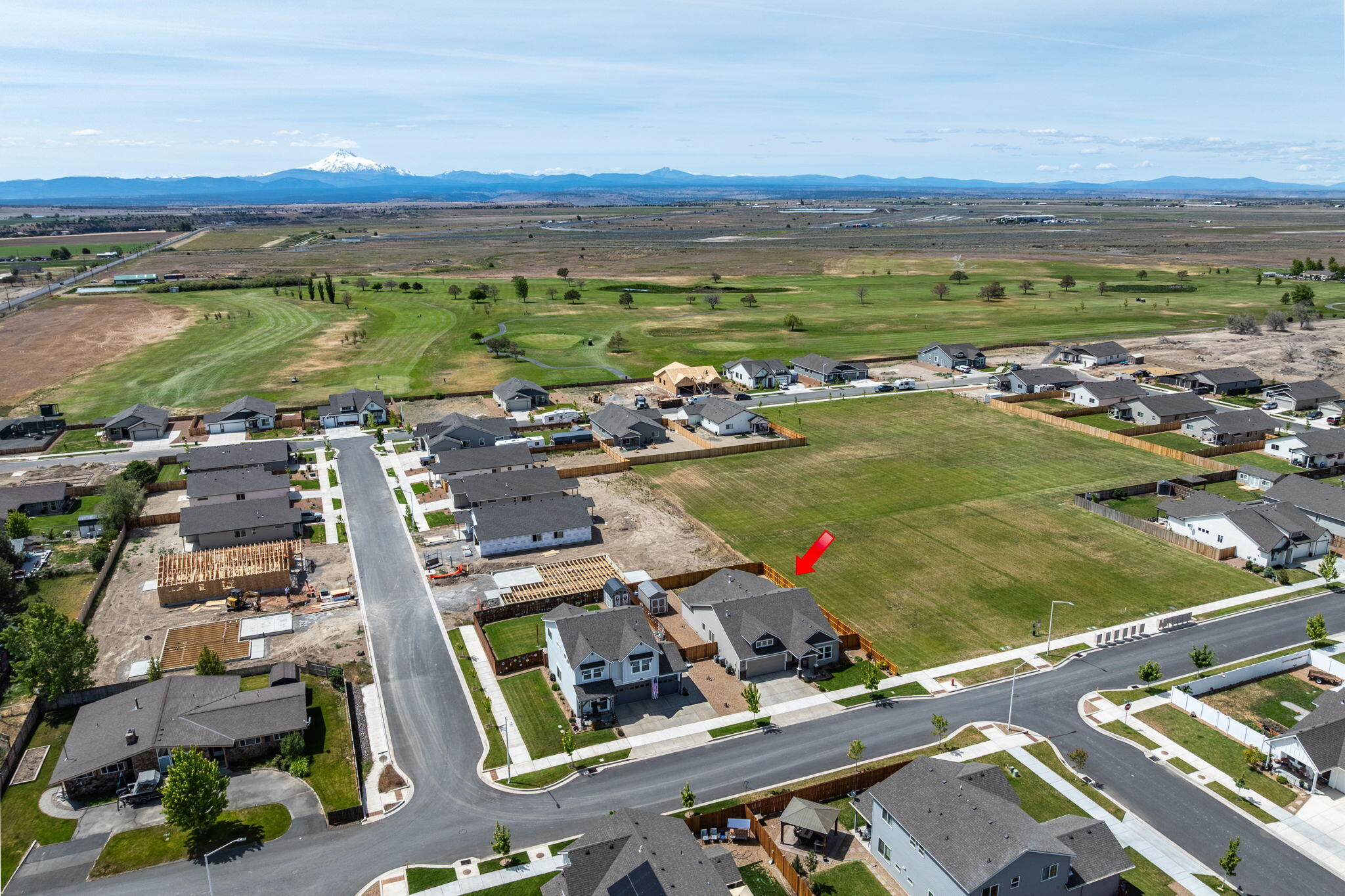 1132 Northwest Golf Course Drive Madras, OR 97741 - Photo 2 of 36 an aerial view of residential houses with outdoor space