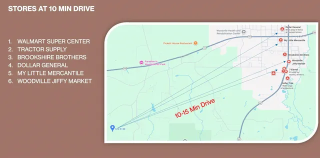 a bedroom with two beds and a large window