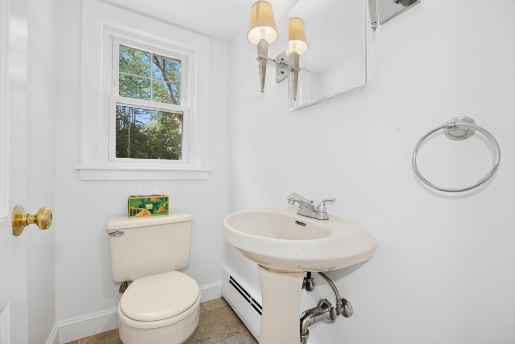 54 Mohawk Drive Acton, MA 01720 - Photo 12 of 42 a bathroom with a sink a toilet and mirror