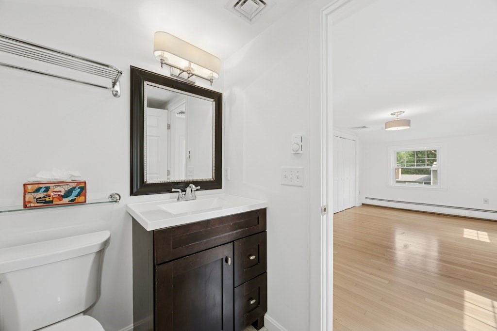 54 Mohawk Drive Acton, MA 01720 - Photo 24 of 42 a bathroom with a sink a toilet and a mirror