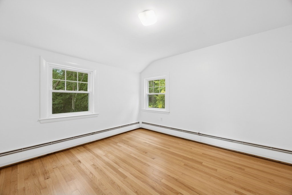 54 Mohawk Drive Acton, MA 01720 - Photo 26 of 42 an empty room with wooden floor and windows