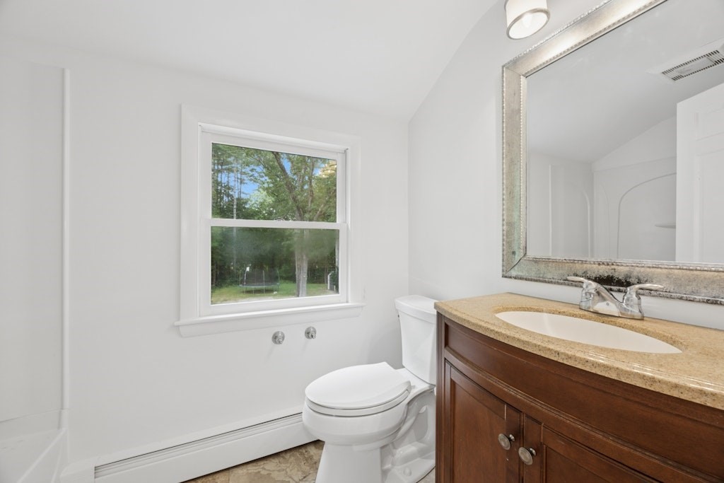 54 Mohawk Drive Acton, MA 01720 - Photo 30 of 42 a bathroom with a sink toilet and mirror
