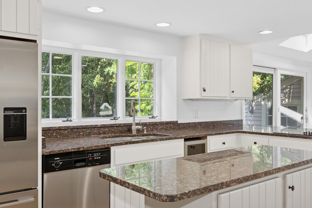54 Mohawk Drive Acton, MA 01720 - Photo 3 of 42 a kitchen with granite countertop a sink window and cabinets