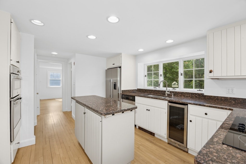 54 Mohawk Drive Acton, MA 01720 - Photo 5 of 42 a kitchen with stainless steel appliances granite countertop a sink stove and refrigerator