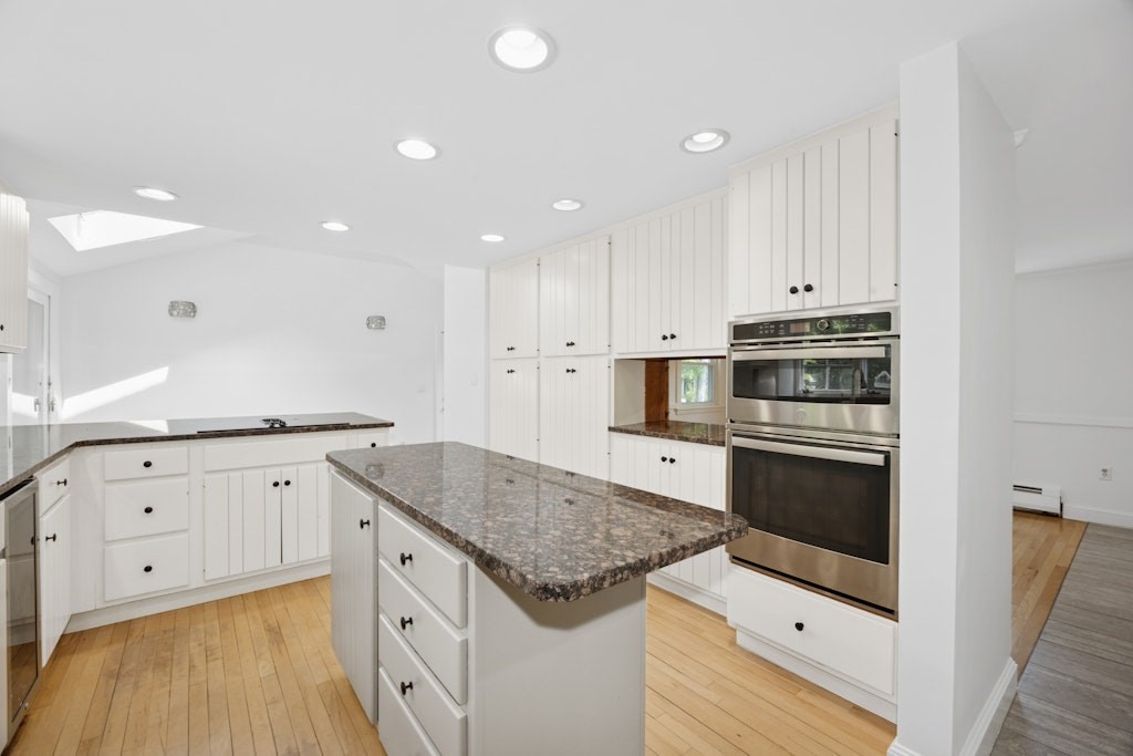 54 Mohawk Drive Acton, MA 01720 - Photo 8 of 42 a kitchen with stainless steel appliances granite countertop a stove and a sink