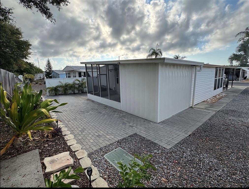 3301 Alt 19, Unit 162 Dunedin, FL 34698 - Photo 21 of 23 a backyard of a house with lots of green space