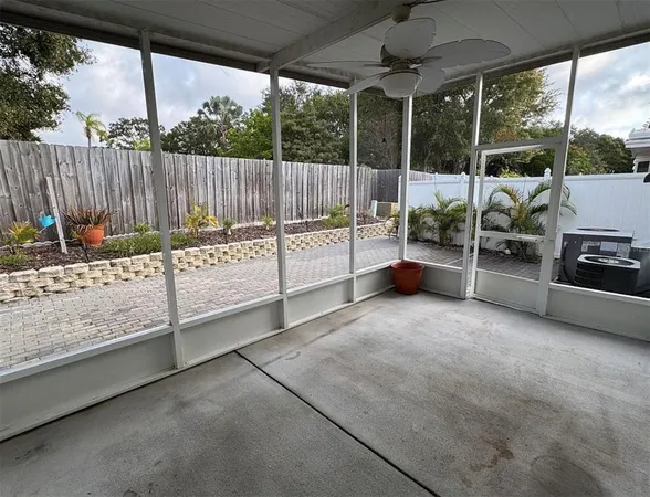a view of a backyard with sitting area and roof