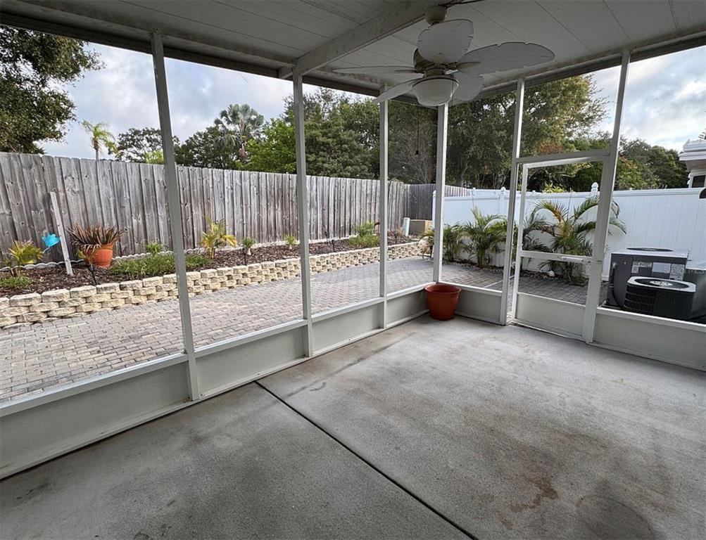 3301 Alt 19, Unit 162 Dunedin, FL 34698 - Photo 22 of 23 a view of a backyard with sitting area and roof