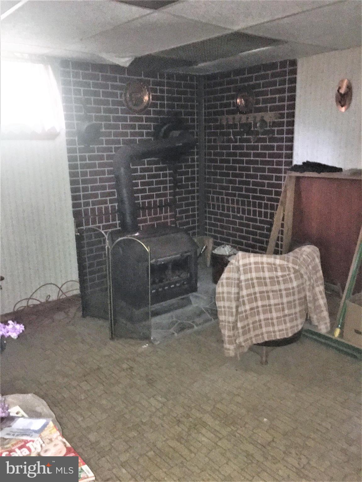 4600 Kiernan Road College Park, MD 20740 - Photo 14 of 22 Basement Wood Stove
