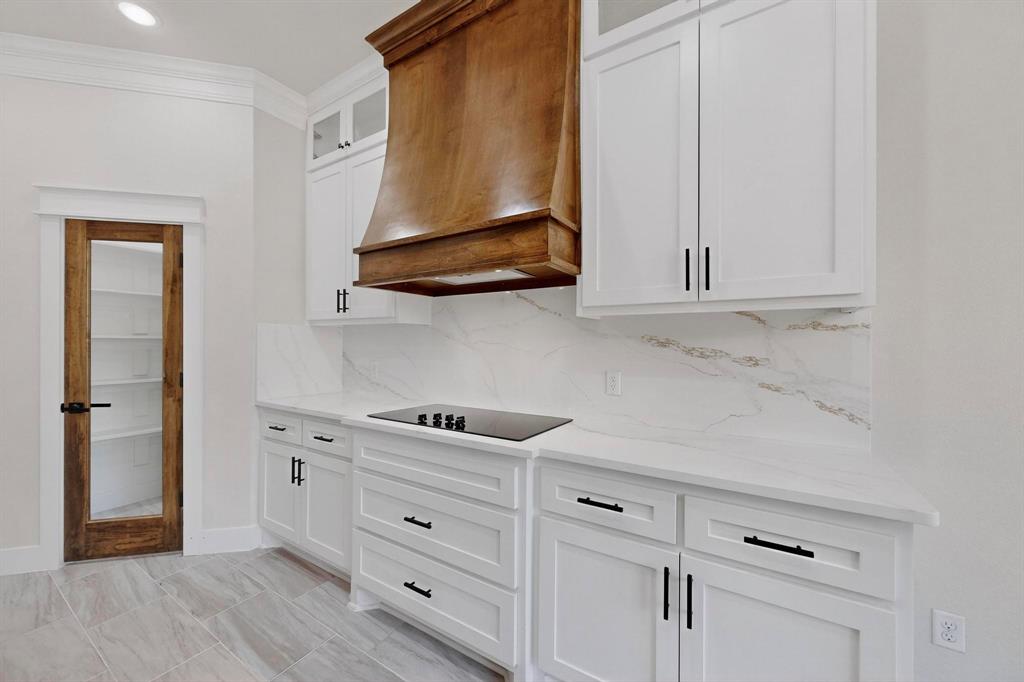 1161 Gonzollas Road Springtown, TX 76082 - Photo 12 of 40 a view of cabinets and wooden floor