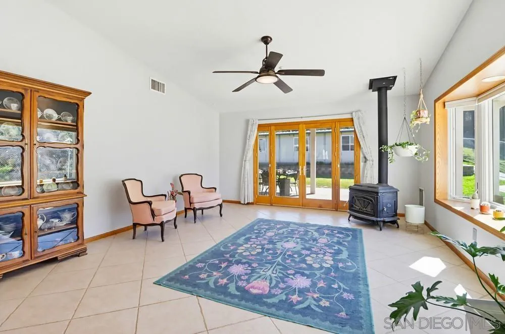 359 Galloway Valley Road Alpine, CA 91901 - Photo 17 of 50 a living room with furniture and a floor to ceiling window