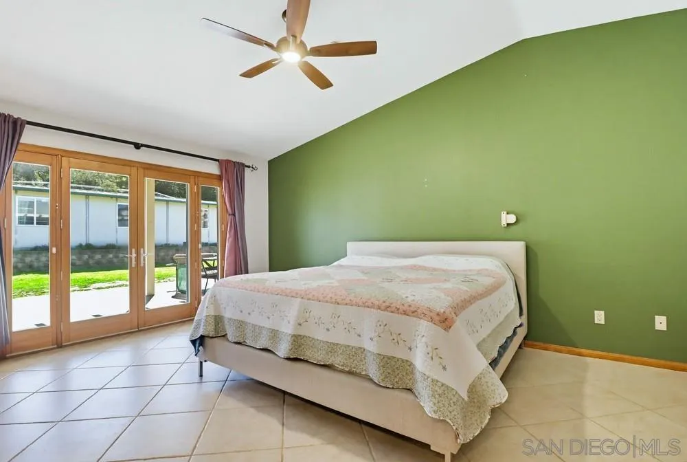 359 Galloway Valley Road Alpine, CA 91901 - Photo 20 of 50 a bedroom with a bed and a large window