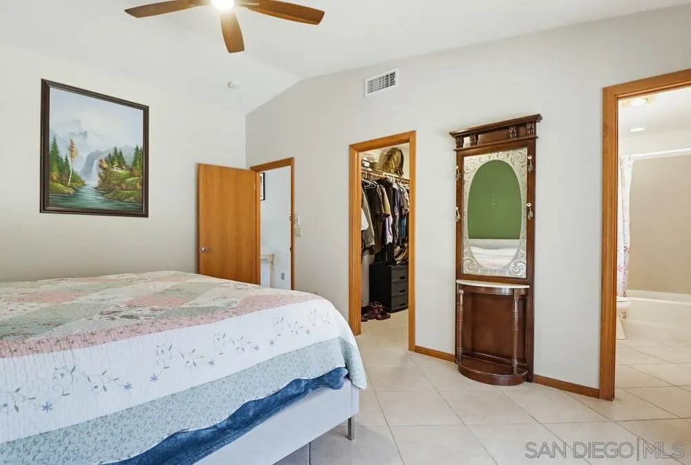 359 Galloway Valley Road Alpine, CA 91901 - Photo 23 of 50 a bedroom with a bed and a mirror