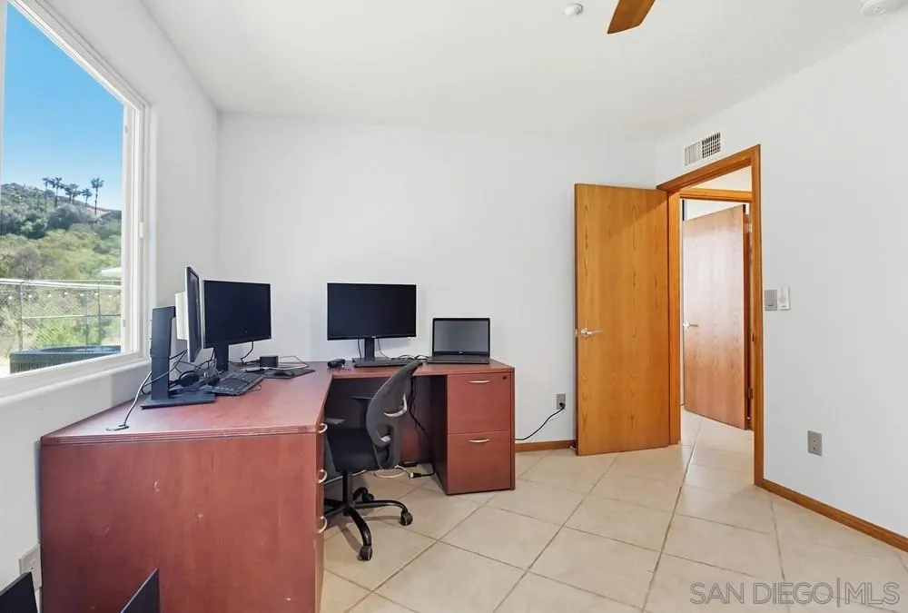 359 Galloway Valley Road Alpine, CA 91901 - Photo 25 of 50 a view of a livingroom with workspace and a window