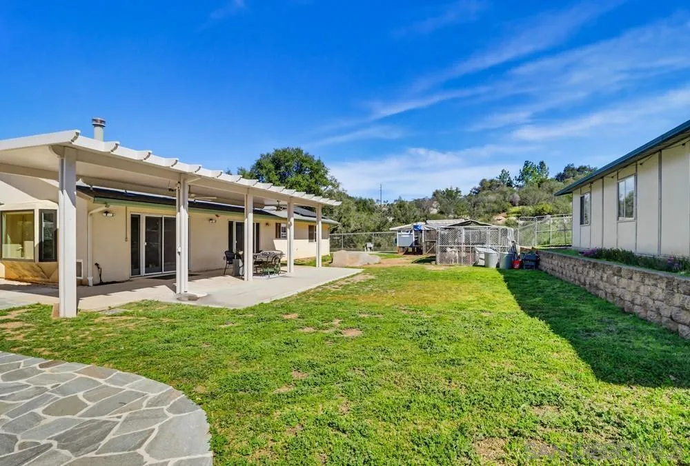 359 Galloway Valley Road Alpine, CA 91901 - Photo 35 of 50 a front view of a house with swimming pool having outdoor seating