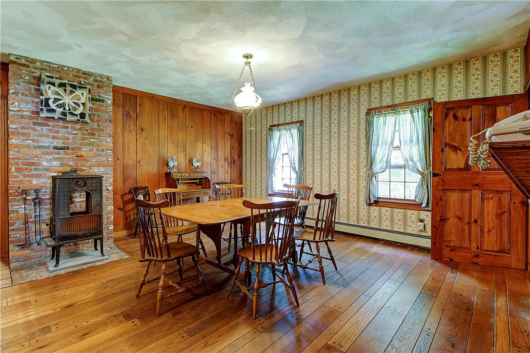 26 Burgess Road Foster, RI 02825 - Photo 42 of 42 The kitchen/dining area is an open floor plan with a cozy wood burning stove