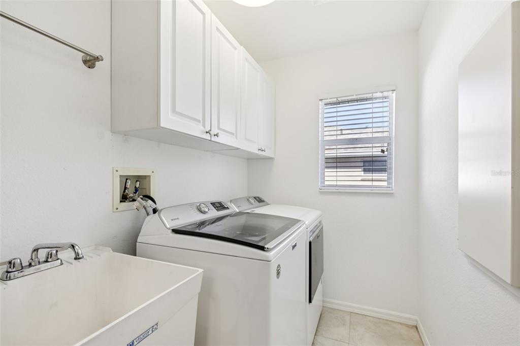 257 Medalist Road Rotonda West, FL 33947 - Photo 15 of 32 a kitchen with a sink cabinets and a window