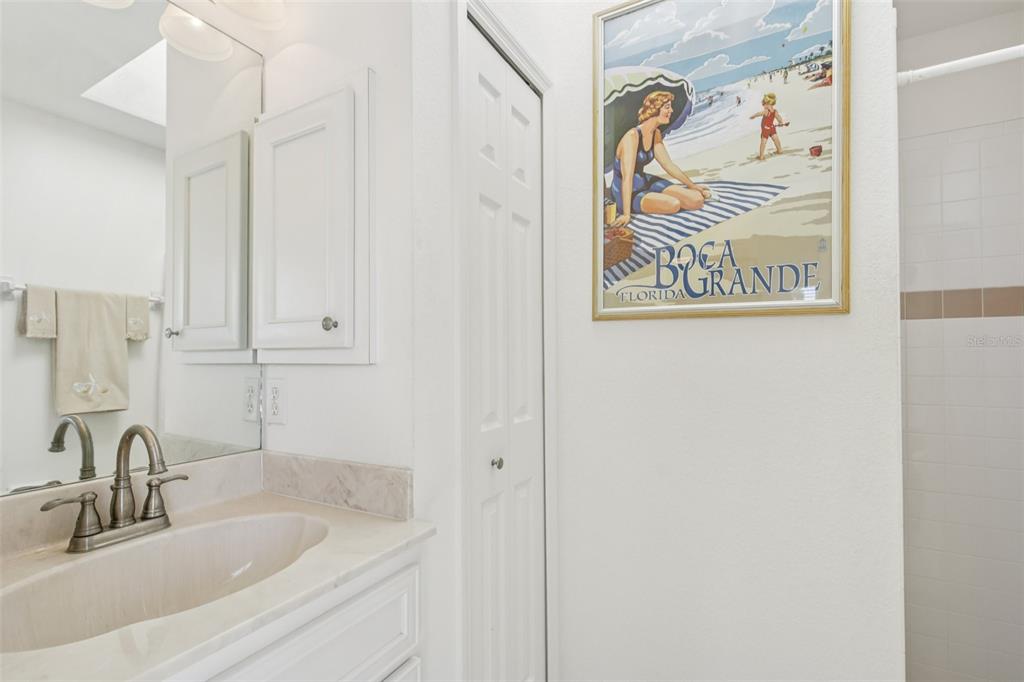 257 Medalist Road Rotonda West, FL 33947 - Photo 17 of 32 a bathroom with a sink and a mirror