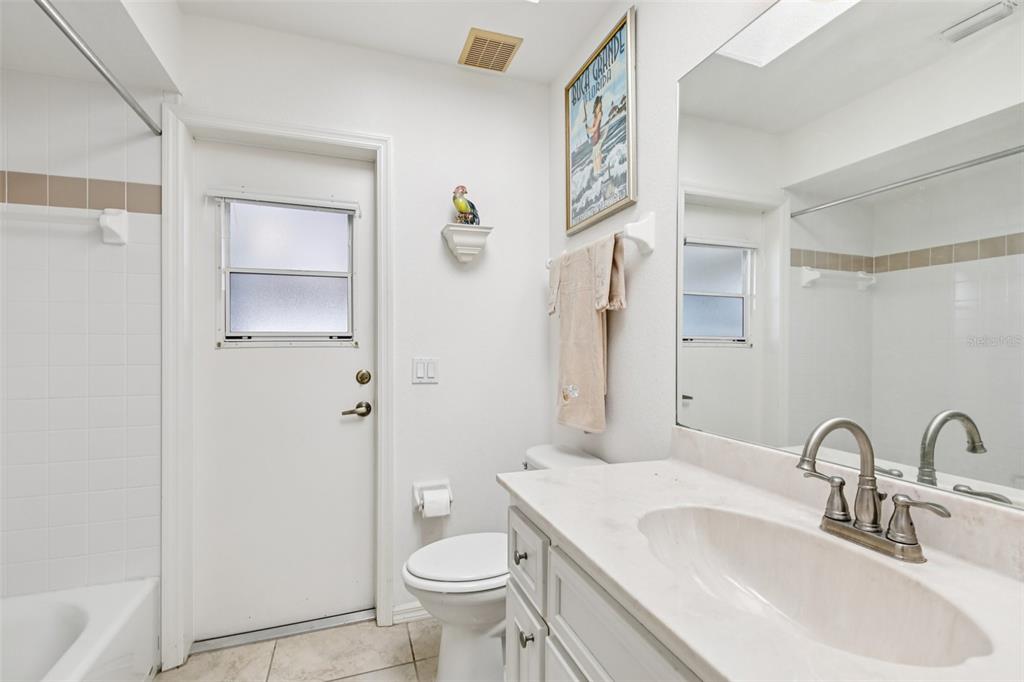 257 Medalist Road Rotonda West, FL 33947 - Photo 20 of 32 a bathroom with a sink toilet and shower