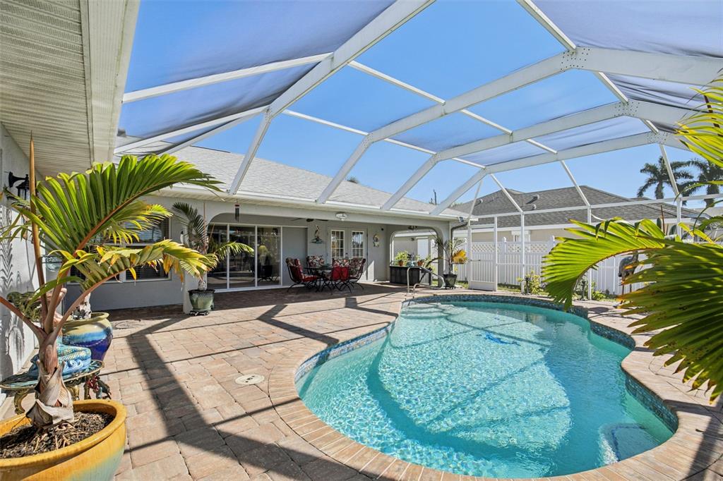 257 Medalist Road Rotonda West, FL 33947 - Photo 24 of 32 a view of a swimming pool with a patio