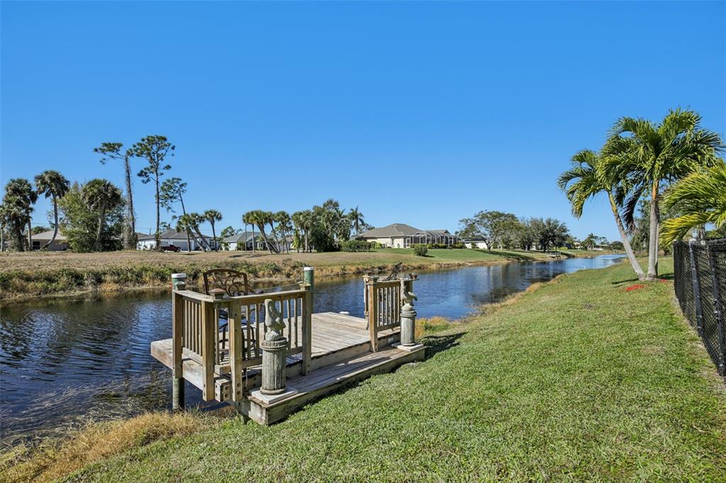 257 Medalist Road Rotonda West, FL 33947 - Photo 25 of 32 a view of a lake with a house
