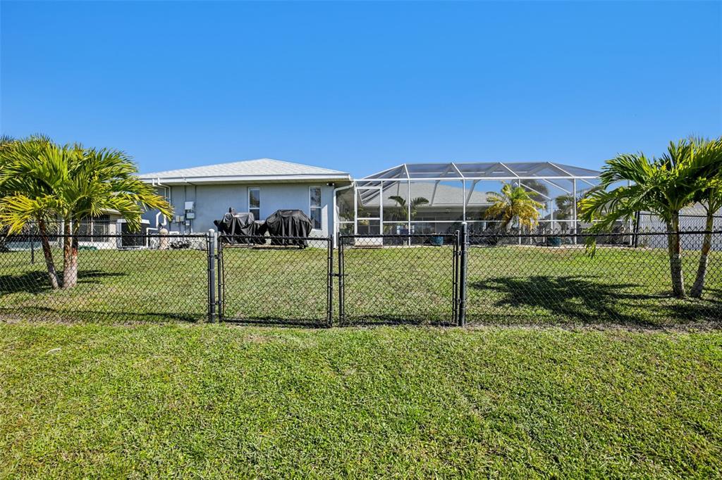 257 Medalist Road Rotonda West, FL 33947 - Photo 27 of 32 a view of a house with backyard