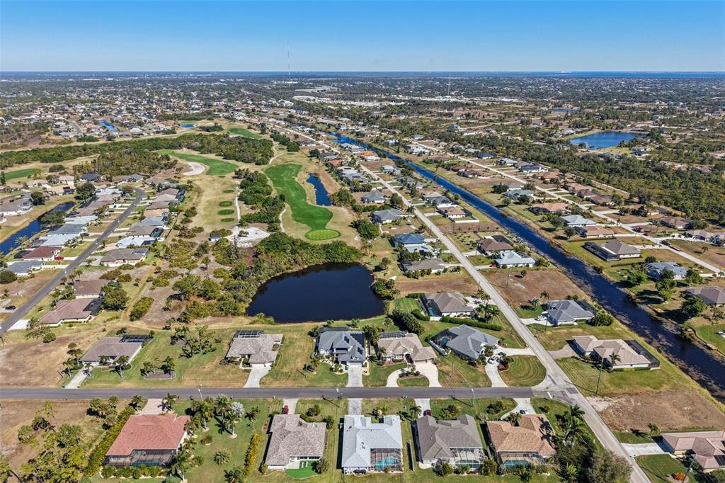 257 Medalist Road Rotonda West, FL 33947 - Photo 29 of 32 an aerial view of residential houses with outdoor space