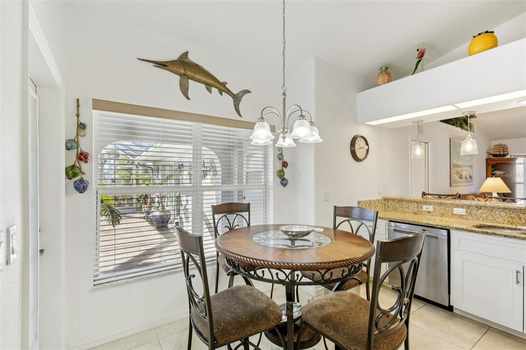 257 Medalist Road Rotonda West, FL 33947 - Photo 7 of 32 a view of a dining room with furniture and a chandelier