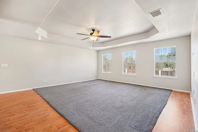 a bathroom with a bathtub sink and mirror