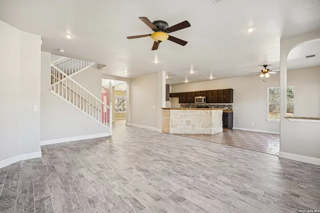 a view of an empty room with a window