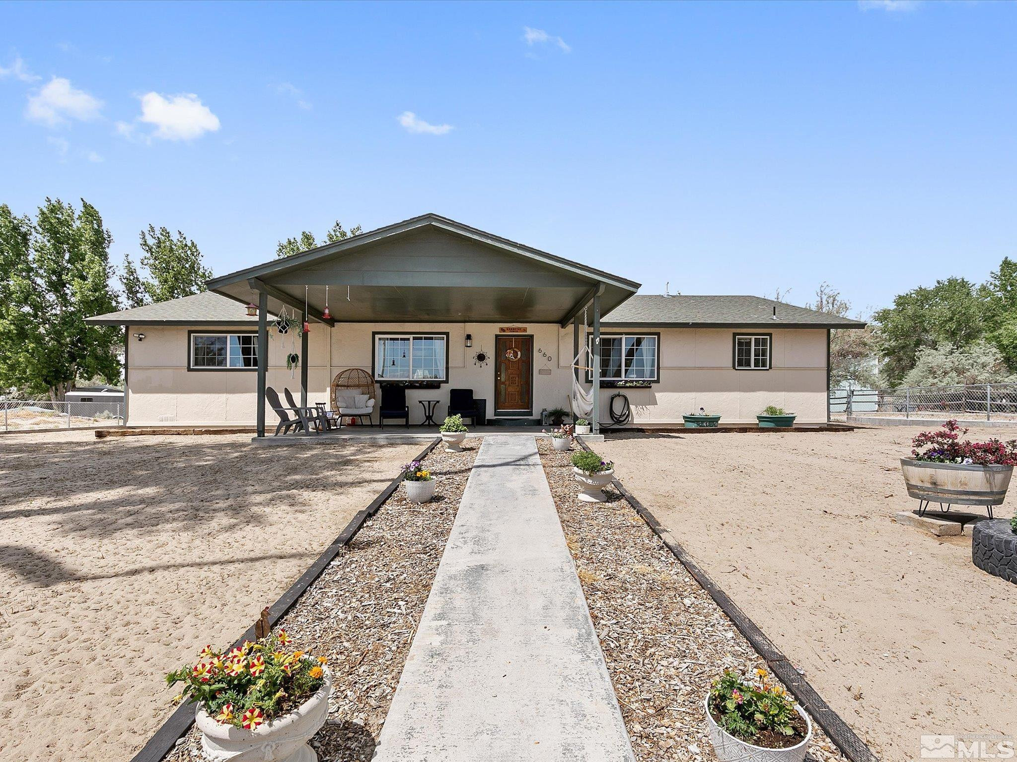 a front view of a house with yard