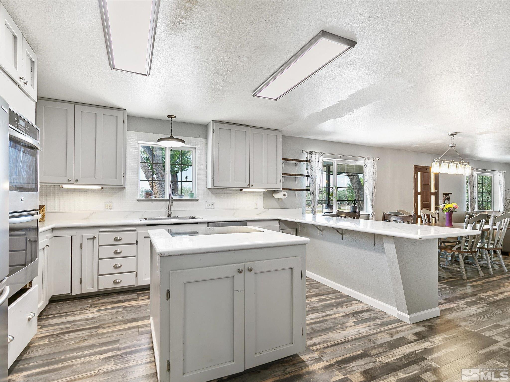 660 Northview Drive Fallon, NV 89406 - Photo 10 of 33 a kitchen with white cabinets stove and sink