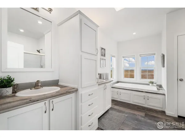 a bathroom with a sink double vanity and a mirror