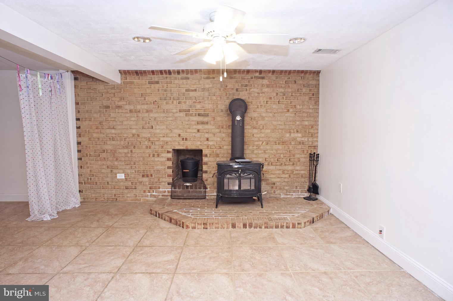 11601 Johns Hopkins Road Fulton, MD 20759 - Photo 25 of 30 Family Room w Wood Stove