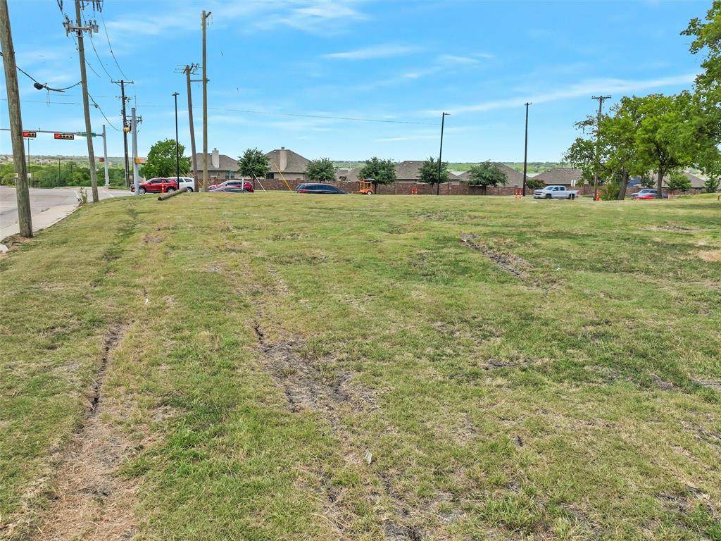 2202 Rowlett Road Garland, TX 75043 - Photo 10 of 16 a view of a green field with trees in the background