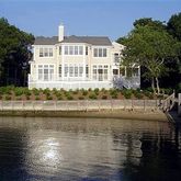a view of residential houses with outdoor space and lake view